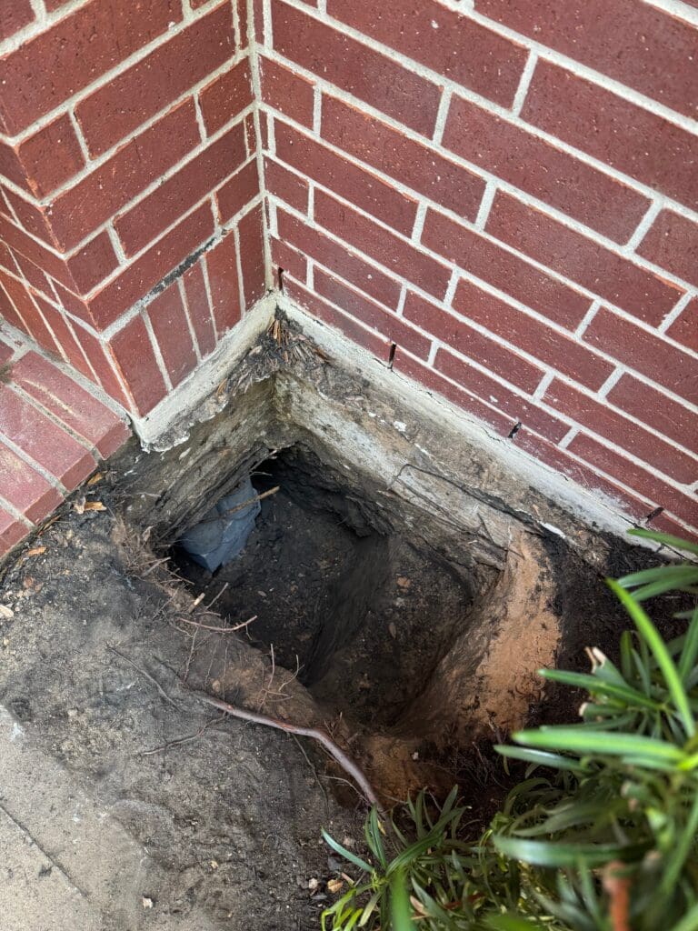 Example of a professional foundation repair job using pressed concrete pilings in Pearland Texas