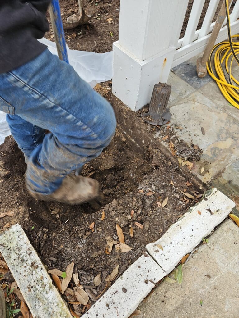 Deep Rock Foundations digs an exterior hole for foundation repair in Pearland, Texas.