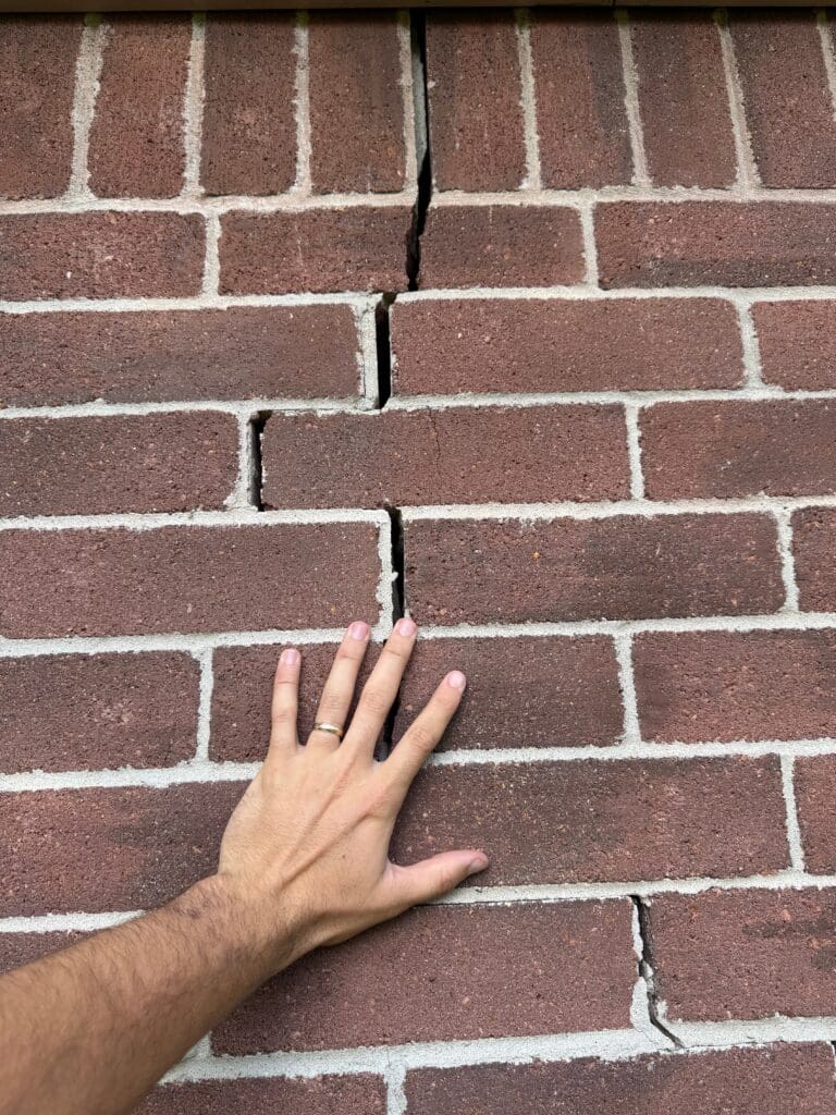 Stair step brick crack fixes by the best foundation repair company in Pearland due to foundation issues