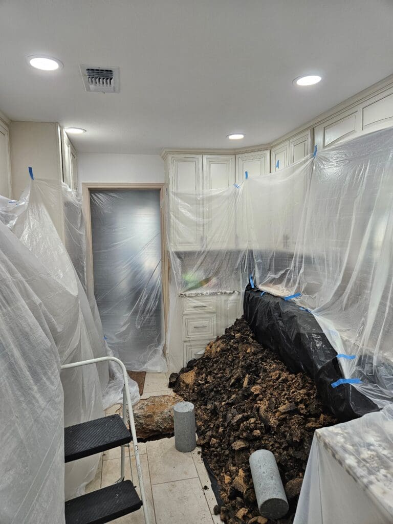 Kitchen completely protected during a foundation repair job in Pearland, Texas.
